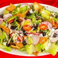 Fattoush Salad · Chopped lettuce, tomatoes, feta cheese, Persian cucumbers, mint , radishes and pita croutons.