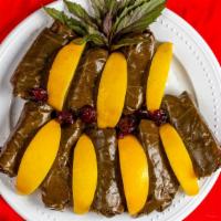 Grape Leaves (5 Pieces) - Dolma · Stuffed grape leaves filled with rice, chopped onions, dill weed, olive oil, mint and spices.