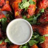 Spicy Garlic Wings 10Pc · Crispy Chicken wings with light batter seasoned with house salt & pepper, hot pepper sauce a...