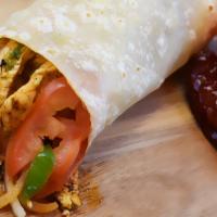 Chipotle Chicken Burrito · Filled with fajita veggies, rice, and cream.