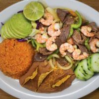 Mar Y Tierra Plate · Served with lettuce, guacamole, carne asada, & shrimp fajitas