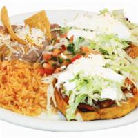 Sopes Plate (2) · Your choice of carnitas, grilled chicken, adobada, or shredded beef.