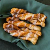 Cinnamon Twists · 180 cal / twist. Rolled in a brown and white sugar cinnamon mixture and topped with a powder...