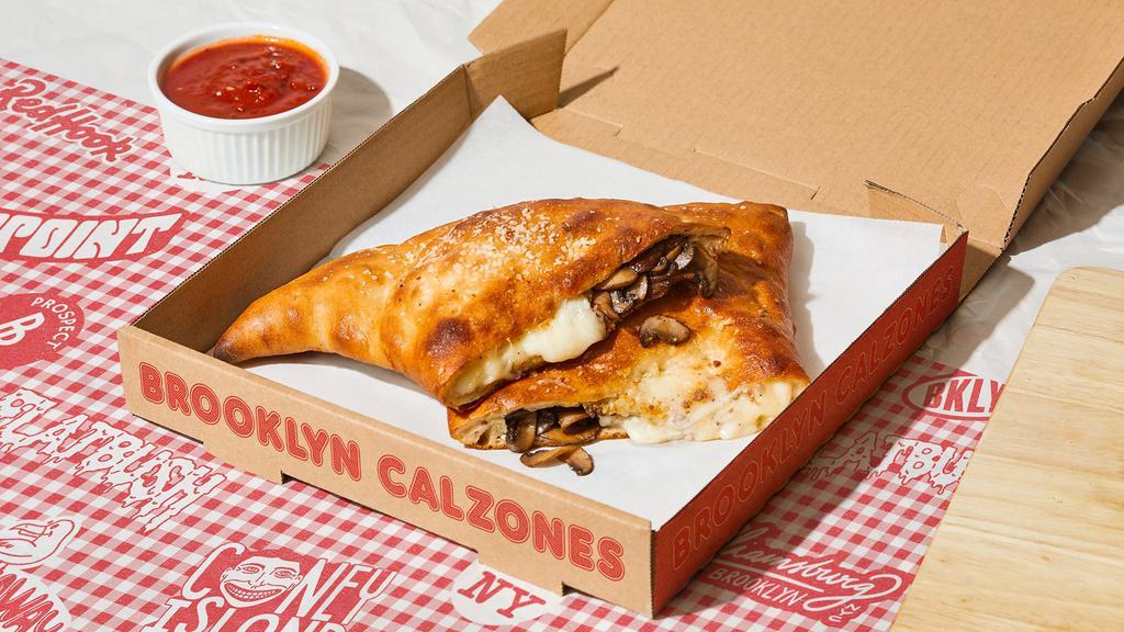 Rockaway Calzone · Calzone with mushroom, melted mozzarella, and a side of marinara. (v)