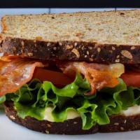 Pheasant Blt · Sourdough Bread, Bacon, Tomatoes, Roasted Garlic Aioli, Lettuce & Fries.