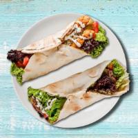 Falafel Fantasy Wrap  · Comes with seasoned falafel, spinach, tomatoes, cucumbers, black olives, red onions, feta ch...