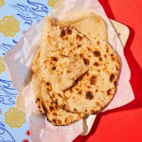 Naan · Tandoor oven baked flatbread.