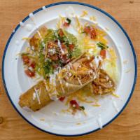 Chicken Flautas · Chicken, lettuce, cheese, cotija, pico, sour cream, and guacamole in a fried flour tortilla.