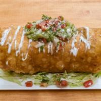 Chimichanga · Refried beans topped lettuce, cheese, cotija, pico, sour cream, and guacamole.