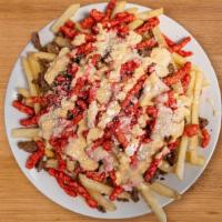 Flaming Hot Monster Fries · Steak, hot cheeto’s, fries, and sour cream.