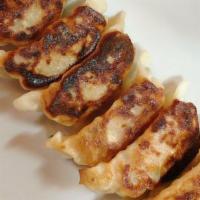 Gyoza / 餃子  · Recommend / オススメ . Pan fried pork dumplings.