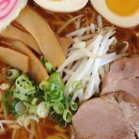 Shoyu Ramen / 醤油ラーメン  · Soy sauce flavor. Comes with boiled egg, bean sprouts, green onions, bamboo shoots and fish ...