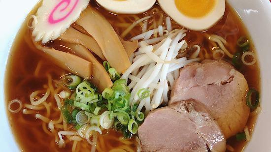 Shoyu Ramen / 醤油ラーメン  · Soy sauce flavor. Comes with boiled egg, bean sprouts, green onions, bamboo shoots and fish cake as a topping.