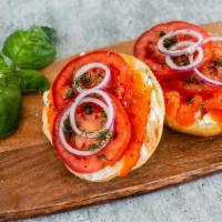 Salmon Lox Bagel · Smoked salmon, bagel, signature cream cheese, tomato, onion, capers, dill.