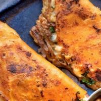 Lamb Birria Tacos (2) · folded corn tortilla, slow braised lamb, mexican cheeses, consomé, onion, cilantro, avocado ...