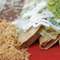 3 Tacos With Rice & Beans · Three corn tortilla tacos with your choice of meat, topped with cilantro, onion, and sauce. ...