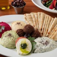Appetizer Combo Platter · Combination of Our Homemade Mediterranean Appetizers Listed Above. Choice of Pita Bread or S...