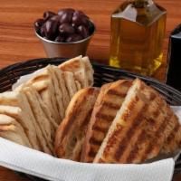 Mediterranean Bread Basket · Choice of Grilled Artisan Bread or Warmed Pita.