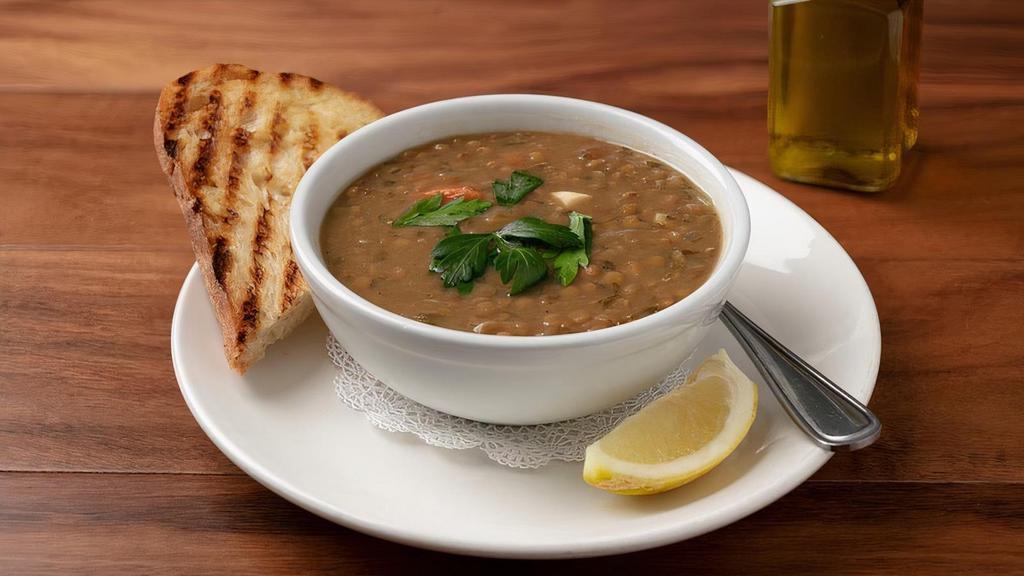 Bowl Lentil Soup · Organic Green Lentils, Tomatoes, Garlic, Red Onion, Parsley, Mint, Crushed Pepper in a Vegetable Broth. (TRUE VEGAN) Served with Warm Pita Bread.