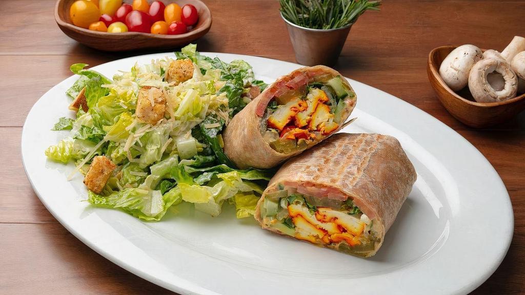 Tofu Wrap · Grilled Organic Tofu, Hummus, Romaine Lettuce, Tomato, Cucumber, Pickle with Fresh Mint and Basil. Wrapped in a Whole Wheat Tortilla.