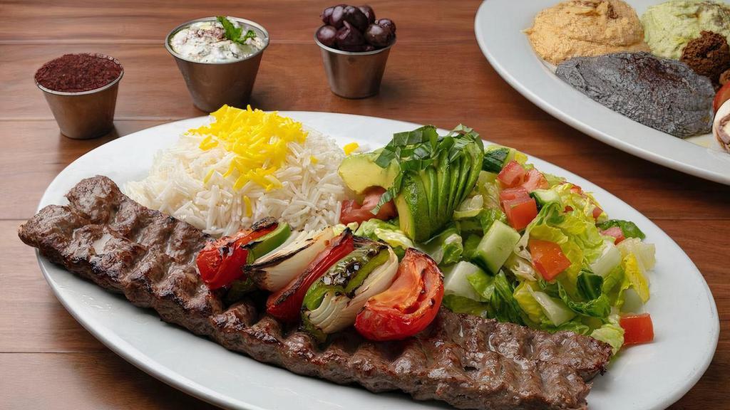 Beef Koobideh Kabob · Two Skewers (One Pound Total) of Charbroiled, All-Natural, ABF (Antibiotic & Hormone Free) Seasoned Ground Beef* with Grilled Vegetables. Served with your Choice of Two Sides.
