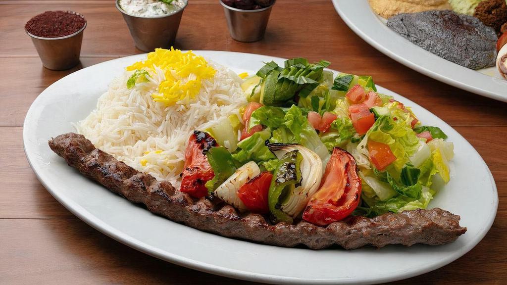 Beef Koobideh Kabob - Single · Half Pound (1 Skewer) of Charbroiled, All-Natural, ABF (Antibiotic & Hormone Free) Seasoned Ground Beef* with Grilled Vegetables. Served with Your Choice of Two Sides.