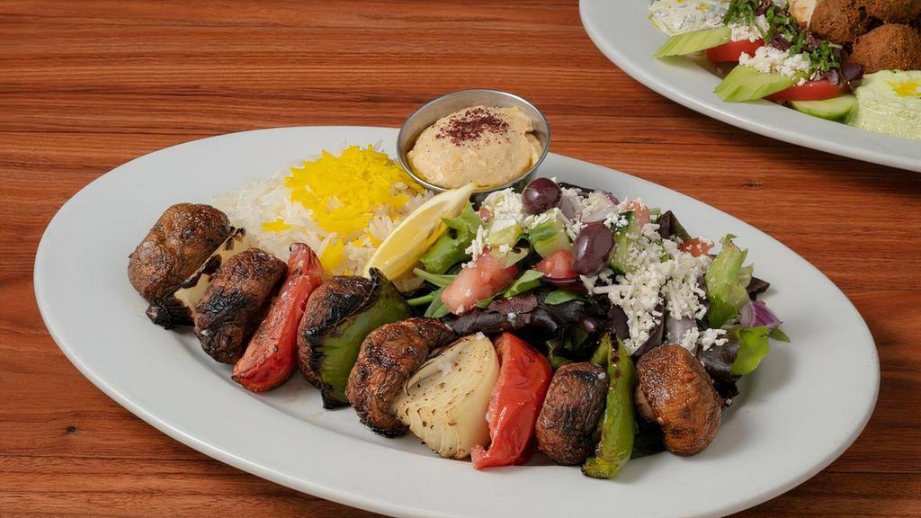Mushroom Kabob · Charbroiled White Elder Mushrooms, Roma Tomatoes, Onions and Bell Peppers. Served with your Choice of Two Sides and Hummus.