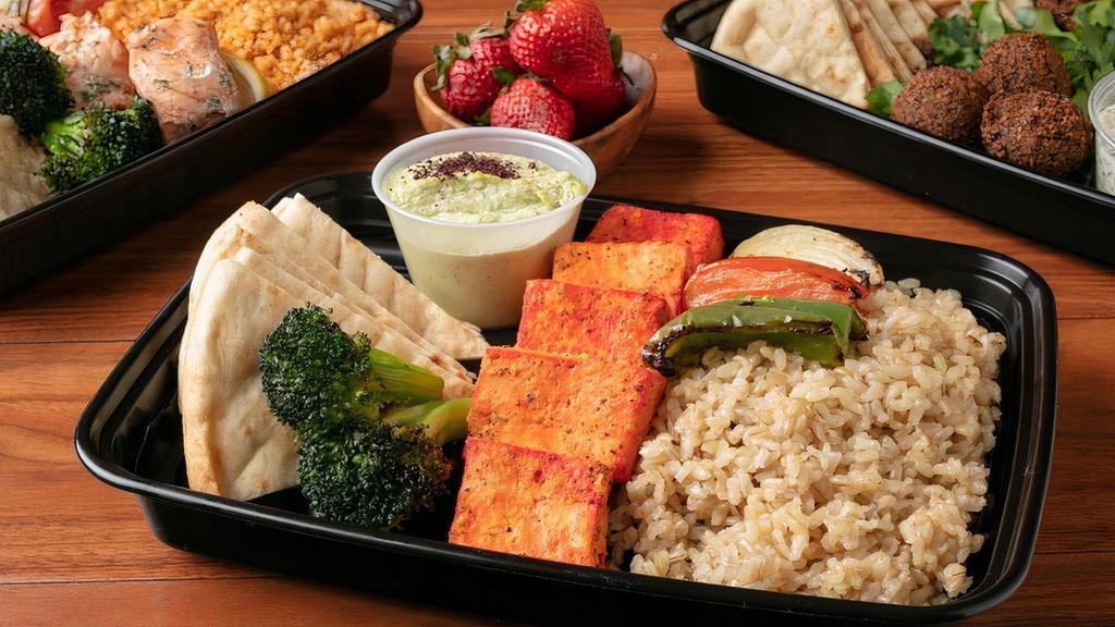 Tofu Ka-Box · Charbroiled Organic Tofu with Grilled Vegetables, Broccoli and Pita Bread. Served with Your Choice of Rice and Spread.