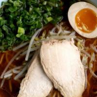 Shoyu Classic · Soy Sauce based Ramen with a deep Chicken Soup Broth, Topped with Green Onions, Bean Sprouts...