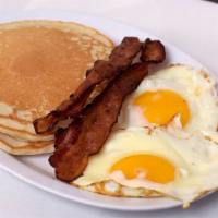 Pancake Breakfast · Two pancakes, eggs, bacon or sausage.