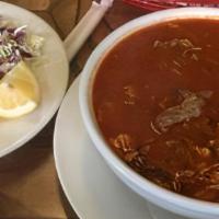 Pozole (Pork & Hominy Soup) · Pork meat with hominy served with condiments & choice of tortillas.