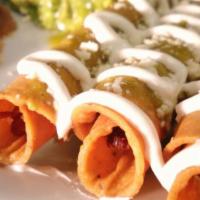 Plate Chicken Flautas · 3 chicken taquitos with sauce, cheese, s-cream and guac.