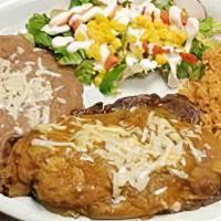 Plate Chile Relleno · Poblano with cheesy potatoes and veggies smother with sauce.