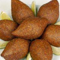 Kebbeh (2 Pcs) · Bulgur mixed with spices, ground beef, onion and spices.