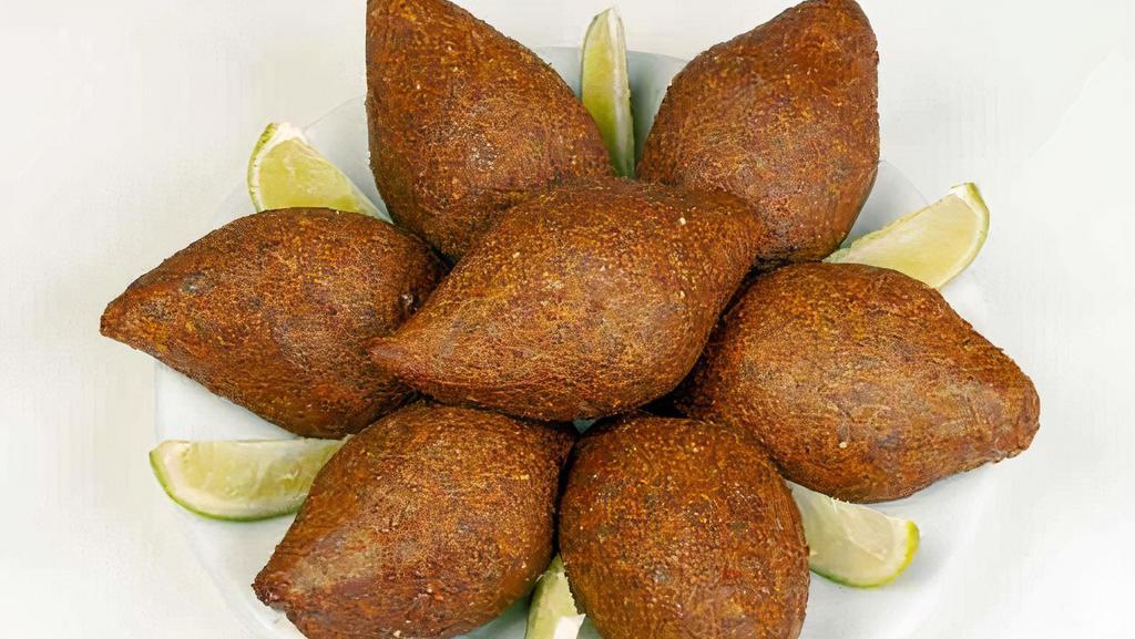 Kebbeh (2 Pcs) · Bulgur mixed with spices, ground beef, onion and spices.
