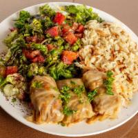 Dolma (Cabbage) · Ground beef meat mixed with rice, parsley, onions, special spices, tomatoes, bell peppers, a...