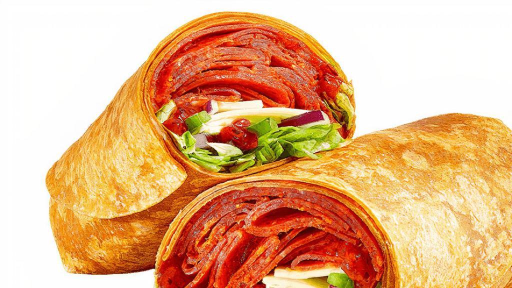 Pizza Sub (720 Cals) · Hot outta the oven, it’s the Pizza Sub Wrap. Enjoy spicy pepperoni, piled high and layered with melt-a-licious cheese and our signature marinara sauce. Topped with green peppers and red onions in a tomato basil wrap.
