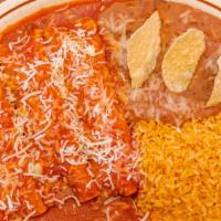 Enchiladas · Served with rice, beans, and salad.