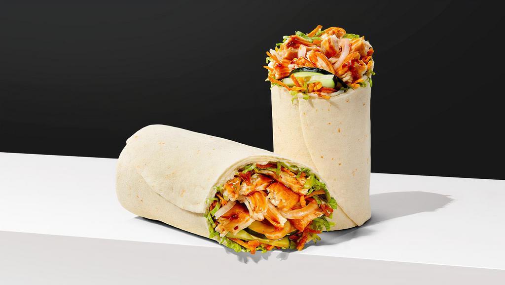 Thai Chicken Wrap · SHREDDED SEASONED CHICKEN Thai satay sauce, crispy carrot noodles, cucumber, onion, lettuce & mayo, in a flour wrap. At participating locations for a limited time.
