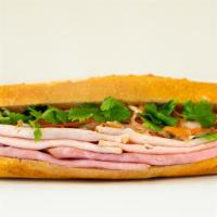 A4 (Ham & Turkey | Banh Mi) · Made Fresh to Order.

Served with Asian Mayo, Pickled Carrot & Daikon, Fresh Cucumber, Cilan...