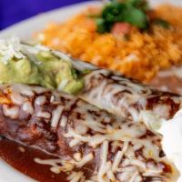 Enchiladas De Mole · Two mole sauce enchiladas filled with Panela and Monterey Jack cheese. Served with rice, ref...