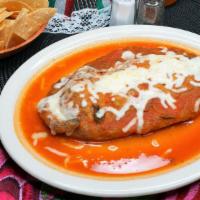 Chile Relleno · Fresh pasilla chile stuffed with cheese, topped with salsa de rajas and Monterey Jack cheese.