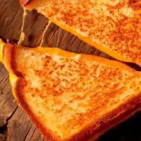 Grilled Cheese Sandwich · Grilled white bread with melted American cheese.