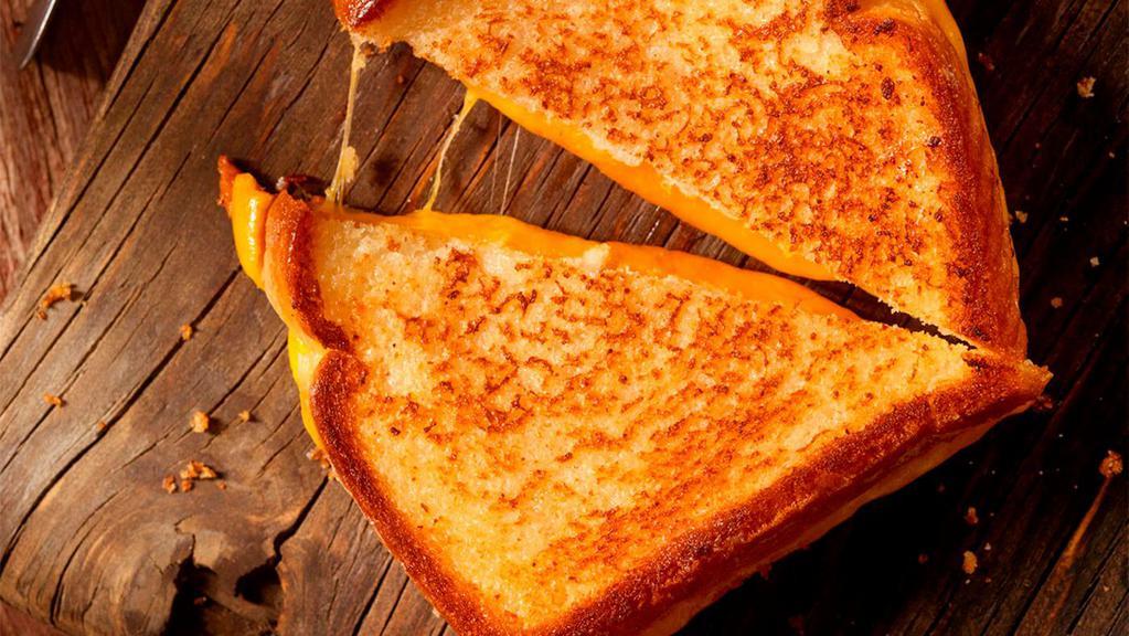 Grilled Cheese Sandwich · Grilled white bread with melted American cheese.