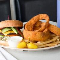 #1. Mania Burger Mania · 1/4 burger patty, cheese, bacon and avocado served with French fries, onion rings and a soda.