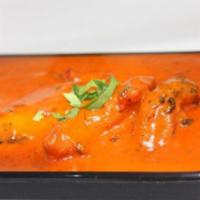 Chicken Tikka Masala · Clay oven roasted boneless chicken breast cubes cooked in a creamy sauce with herbs and spic...