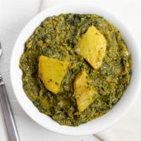 Saag Paneer · Minced spinach with home made cheese cubes in a light creamy sauce.