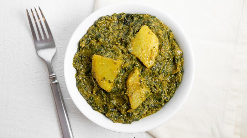 Saag Paneer · Minced spinach with home made cheese cubes in a light creamy sauce.