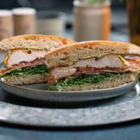 Clb Sndwch · grilled chicken with cheddar, nitrate free bacon, arugula, tomato, tarragon mayo, served on ...