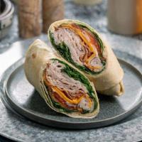 Trky Clb Wrp · flour tortilla rolled up + stuffed with turkey club, cheddar, bacon, tomato, arugula, lemon ...